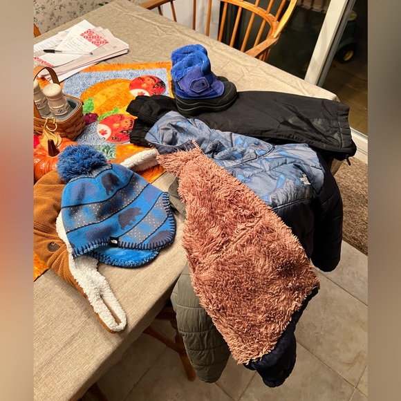 The North Face winter jacket, boots, hat and gloves. Off brand black snow pants. - Picture 1 of 1